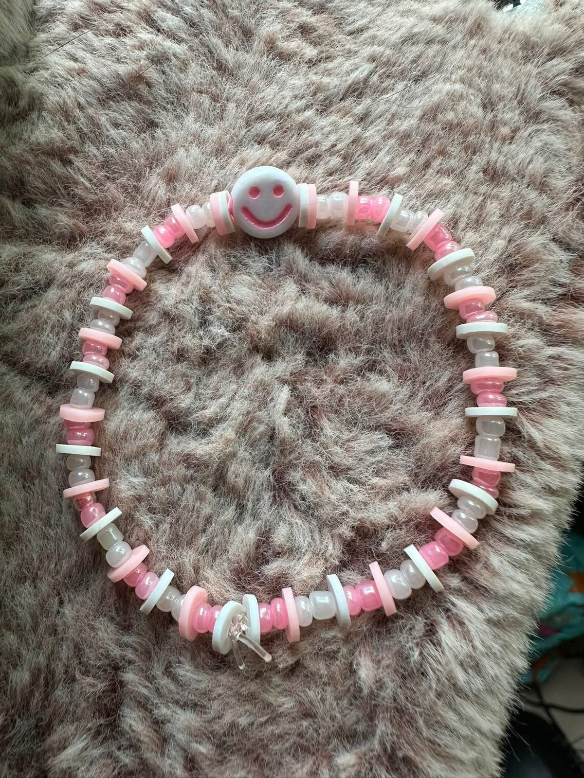 pink and white smiley face bracelet